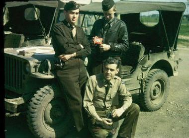 Three guys in front of a Jeep. Photograph by John Michael, who was stationed at Attlebridge with the 466th Bomb Group.