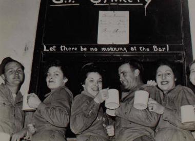 WACs and GIs at the bar of the station 'date room' at Old Catton Headquarters, 21 September 1943. (Digital archive reference MC 371/805)